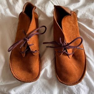 Clarks moccasin-like leather shoes.
